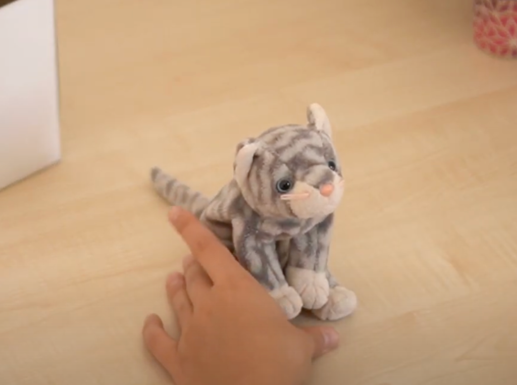 Gray white stuffed cat symbolising a sentimental item