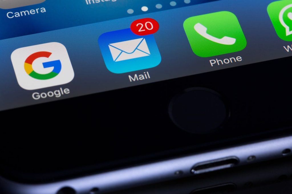 Part of an iPhone screen with the mail icon with 20 unread messages